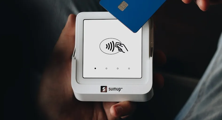 A person holding a credit card in their hand